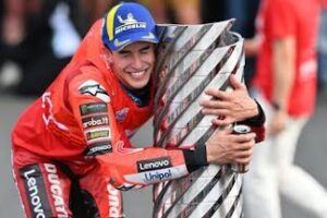Marc Márquez raising his arms in celebration on his Ducati at Motegi